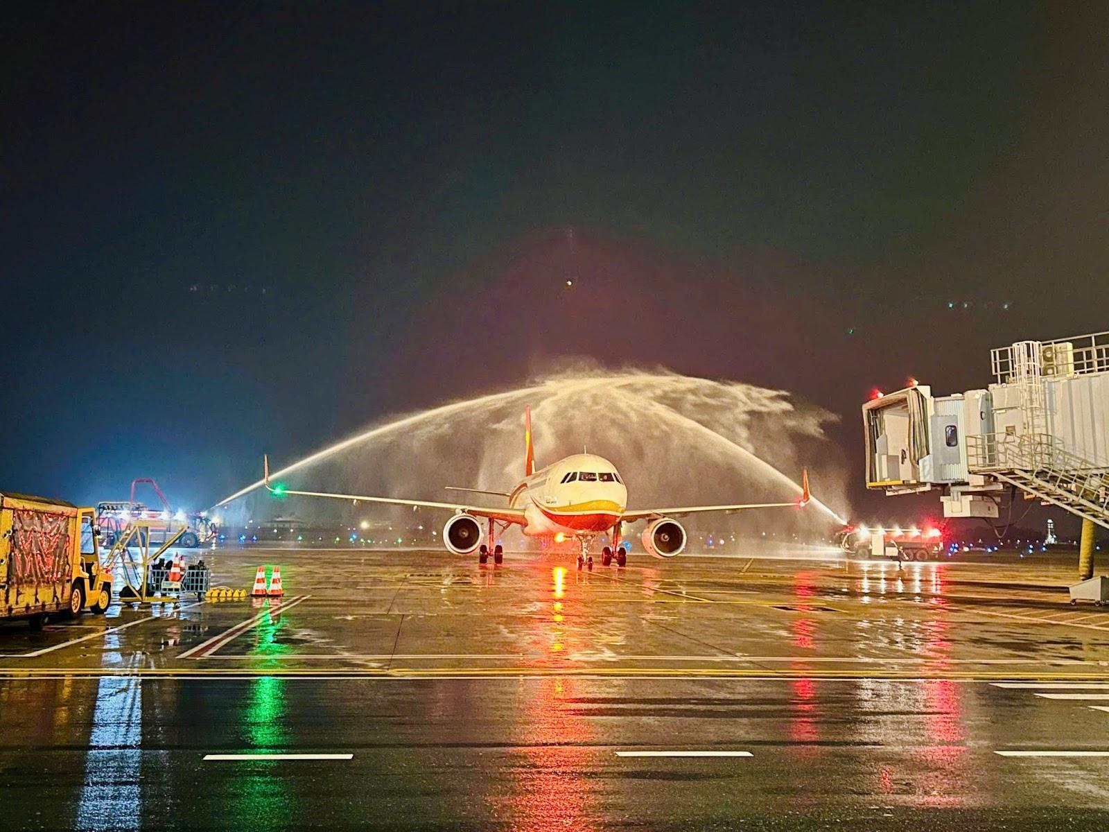 A jet plane on a runway at nightAI-generated content may be incorrect.