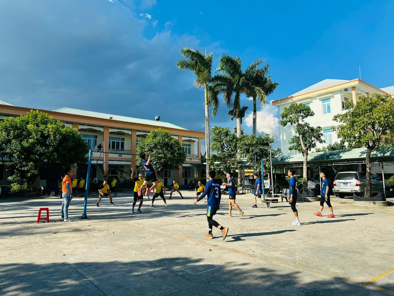 A group of people playing footballDescription automatically generated