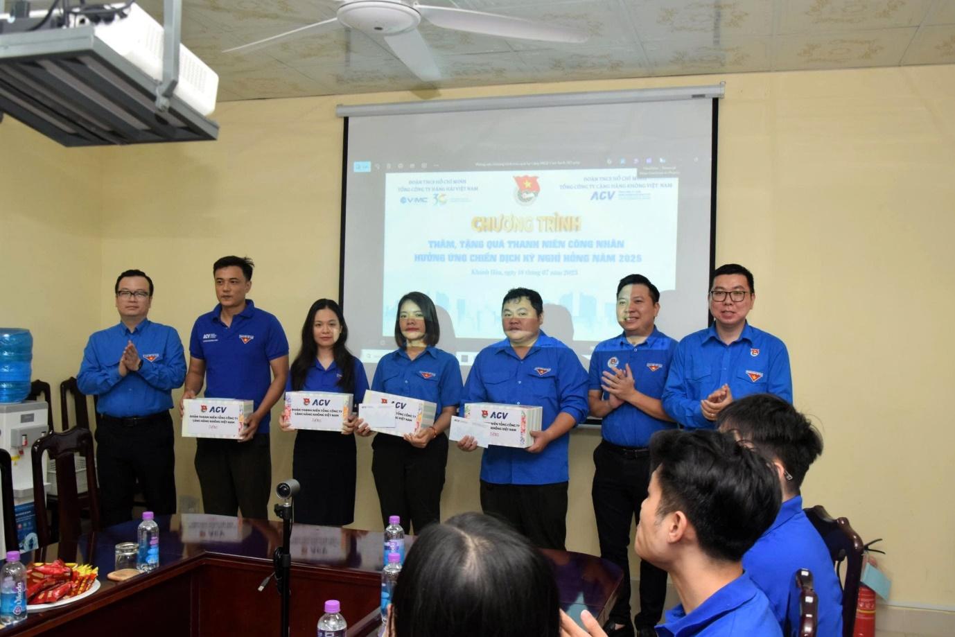 A group of people standing in front of a projector screenAI-generated content may be incorrect.