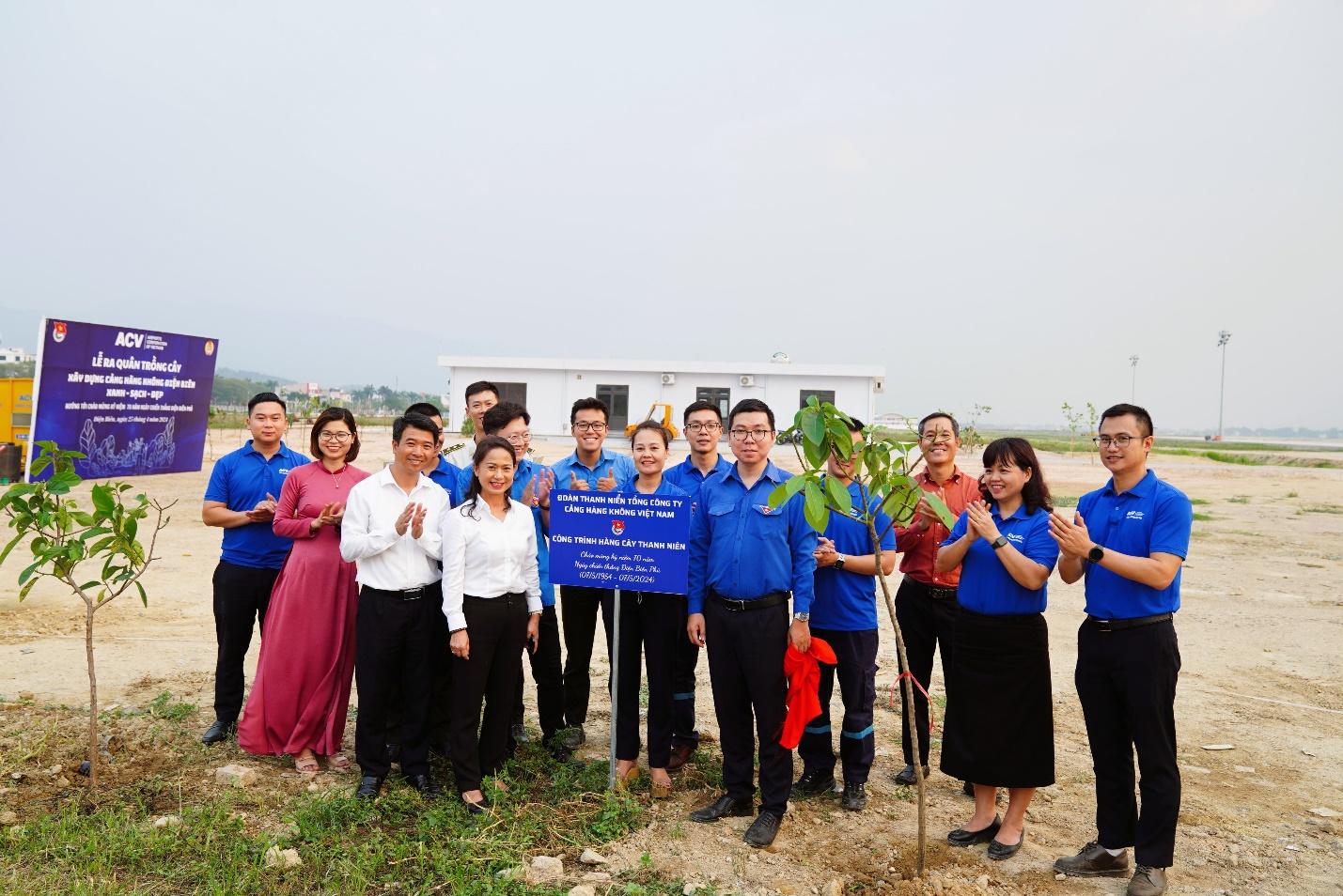 A group of people standing in a fieldDescription automatically generated