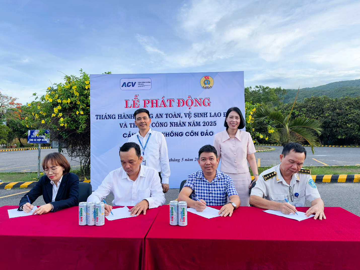 A group of people sitting at a table with a signAI-generated content may be incorrect.