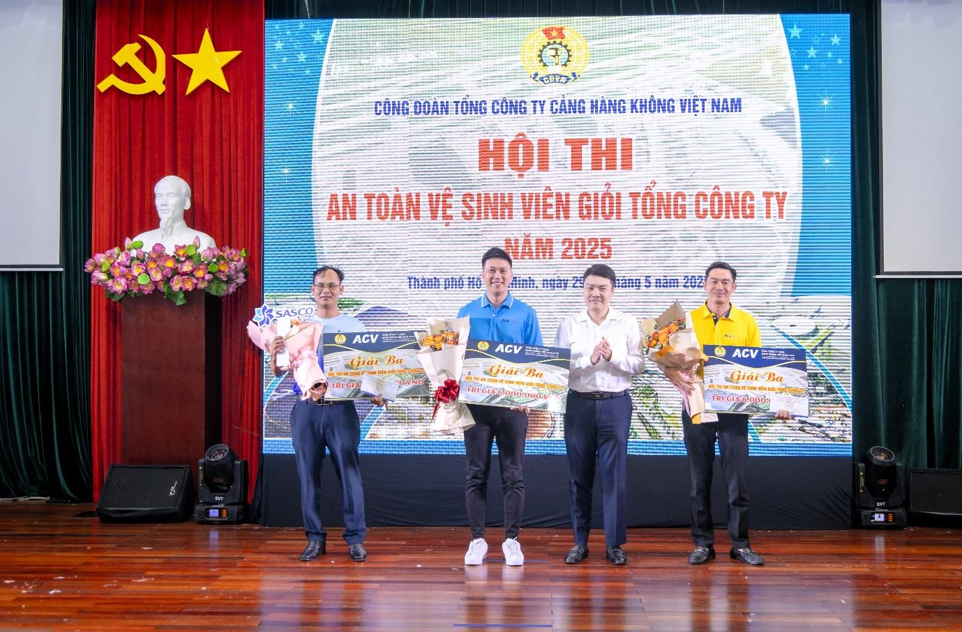 A group of men on a stage holding flowersAI-generated content may be incorrect.